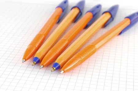 pens ink pens resting on graph paper